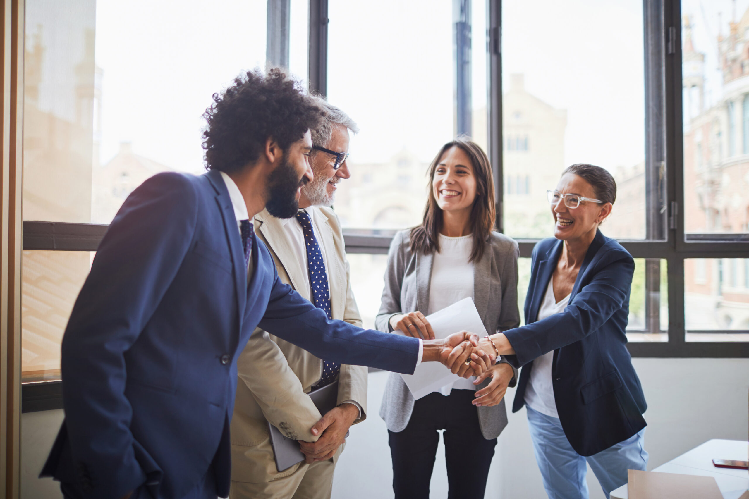 Two organizational partners shake hands